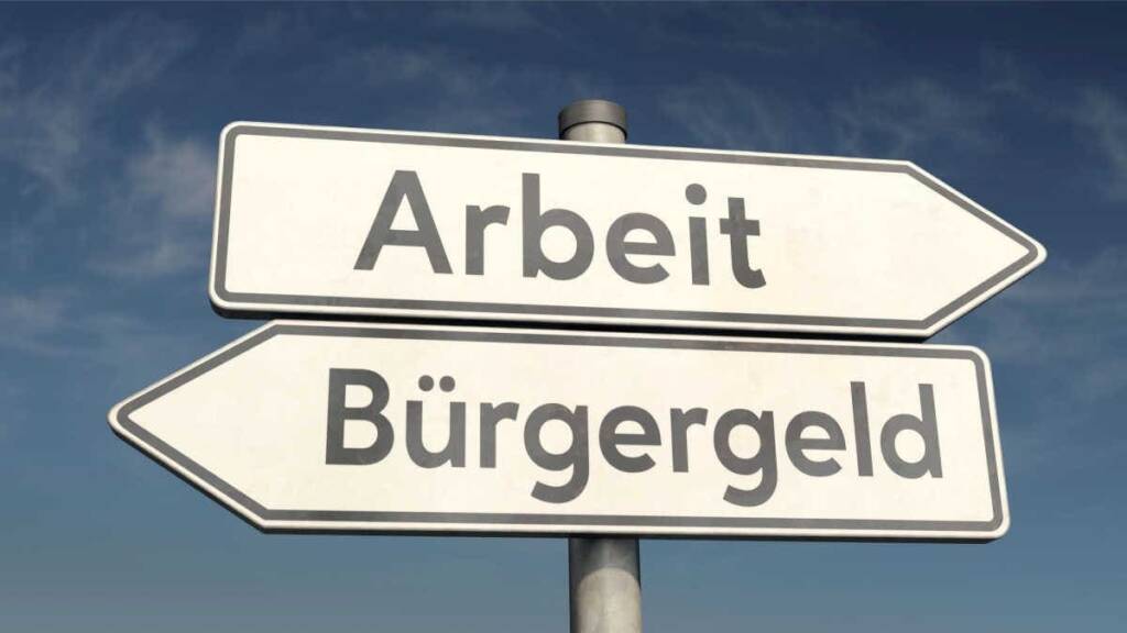 Schilder mit Aufschrift Bürgergeld und Arbeit