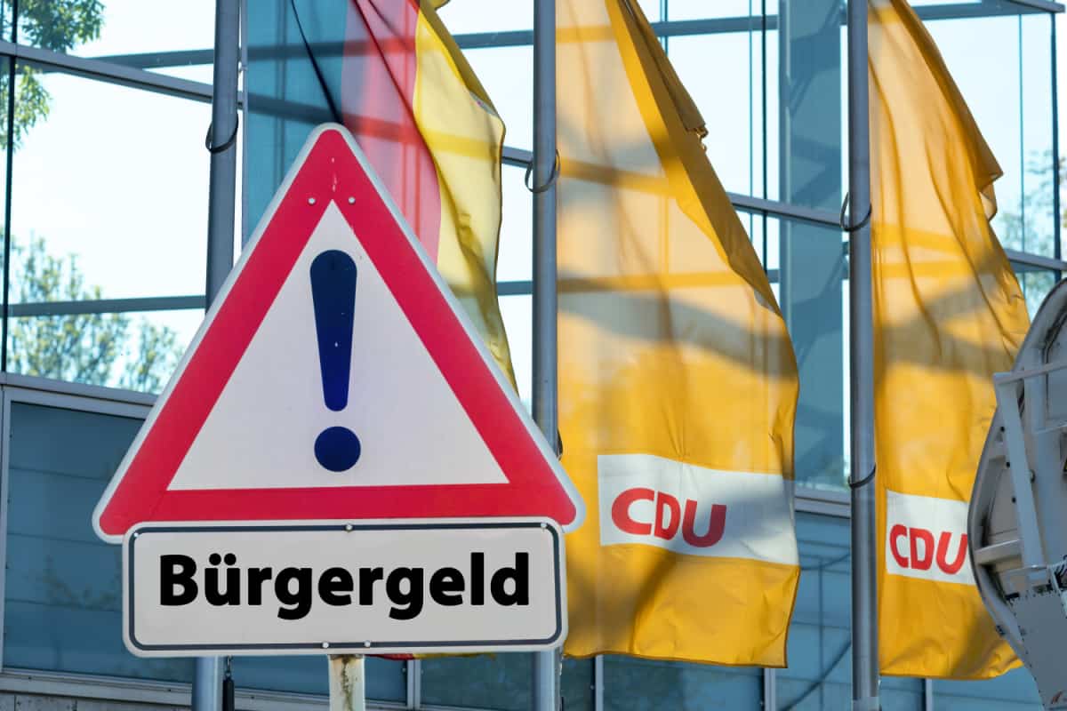 CDU Zentrale mit Bürgergeld Schild im Vordergrund